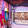 Vibrant Bar Interior With Graffiti Walls Neon Sign Metal Mesh Ceiling And Decorative Elements