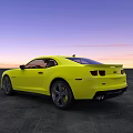 Yellow Sports Car With Sleek Design Against Sunset Sky On Open Ground