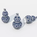 Three Decorative Traditional Blue And White Porcelain Gourd Vases With Intricate Patterns