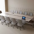 Modern Conference Table In Meeting Room With Gray Chairs Laptop And Decorative Walls