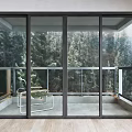 Black Frame Glass Sliding Doors Connecting Indoor And Balcony With Tree View