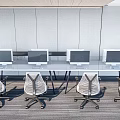 Modern Office Desks With Computer Monitors And Ergonomic Chairs Arrangement