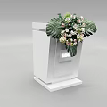 Sleek White Functional Desk With Decorative Flower Bouquet And Large Leaves