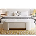 Double Bed With Upholstered Headboard White Pillows Nightstands And Bench On Patterned Rug