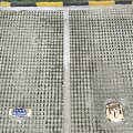 Urban Road Facilities With Grid Patterned Pavement Blue Traffic Sign And Manhole Cover