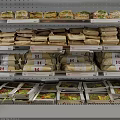 Retail Display Shelves Stocked with Organized Prepackaged Food Items Sandwiches and Meals