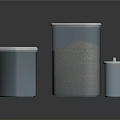 Metal Storage Tins With White Lids Holding Granular Contents On Dark Reflective Surface