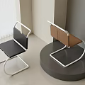 Minimalist Office Chairs With Black And Brown Seats And Metal Frame On Indoor Display Stand