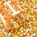 Orange And White Kids Play Structure Surrounded By Yellow Orange And White Plastic Balls