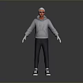 Man in Gray Hoodie Black Pants and Black White Sneakers with Glasses on Gray Background