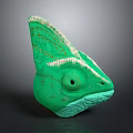 Detailed Green Chameleon Head Sculpture With Textured Skin And Horned Crest