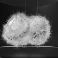 Large White Fluffy Art Installation Suspended In Dark Room With Person Interacting