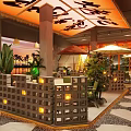 Restaurant Interior Featuring Red Canopy Black Characters Green Plants And Stone Slab Flooring