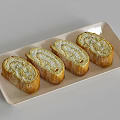 Four Sliced Rolled Food With Cream Filling And Golden Crust On Light Colored Rectangular Tray