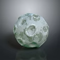 Decorative Wood And Stone Spherical Ornament With Greenish Pockmarked Surface Texture