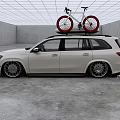 White Mercedes SUV With Red Bicycles Mounted On Roof Rack In Modern Indoor Garage