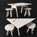 White Kids Table With Two Matching Stools Pencils And Paper On Top Surface