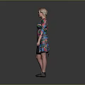 Woman in Colorful Floral Dress Standing with One Hand on Hip Against Gray Background