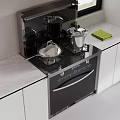 Modern Kitchen Stove With Stainless Steel Pots Pans Green Towel And Marble Countertop