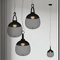 Modern Transparent Glass Pendant Lights With Black Frame Hanging In Room
