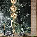 Luxurious Green Marble Feature Wall With Gold Circular Lighting And Green Plants