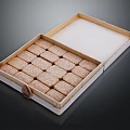 Wooden Box Containing Neatly Arranged Small Square Brown Dessert Pastries
