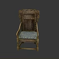 Vintage Wooden Chair With Ornate Carvings And Blue Fabric Cushioned Seat