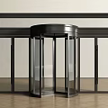 Modern Revolving Door Entrance With Glass Panels And Black Frame Design