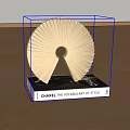 Chanel The Vocabulary of Style Book With Golden Decorative Sculpture On Wooden Floor
