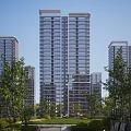Modern High Rise Residential Building With Glass Curtain Walls And Surrounding Greenery