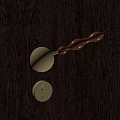Elegant Golden Door Handle With Wooden Grip On Dark Wooden Door And Round Lock Plate