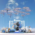 IndoSoul Event Setup With Hanging Purple White Umbrella Decorations And Blue Pink Floral Arrangements