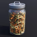 Clear Glass Jar With Silver Lid Filled With Colorful Spiral Pasta