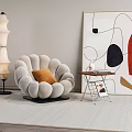 Petal Shaped Single Sofa With Orange Cushion And Abstract Painting Side Table On Light Rug