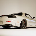 White Modified Sports Car with Alloy Wheels Red Brake Calipers and Sporty Exterior Design