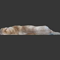 Yellow Labrador Retriever lying on black smooth surface with body stretched out resting