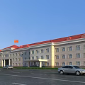 Office Building With Red Roof Light Colored Facade Parking Lot And Flag Under Blue Sky
