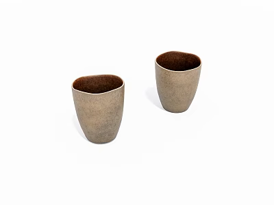 Two Elegant Beige Tea Cups With Textured Surface And Dark Interior On White Background 3d model