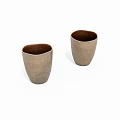 Two Elegant Beige Tea Cups With Textured Surface And Dark Interior On White Background