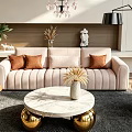 Beige Velvet Sofa With Brown Cushions And Round Marble Coffee Table With Gold Base