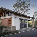 Traditional Style Post Station With Gabled Roof White Walls And Wooden Lattice Along Road