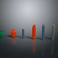 Colored Cylindrical Gas Cylinders In Various Colors Sizes On Dark Reflective Surface