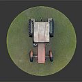 Old Orange Green Tractor Model With Large Tires On Green Circular Base