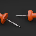 Two Orange Push Pins On Black Background For Office Stationery Use