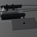 White MacBook Laptop Connected to Power Strip with Multiple Plugs and Cables