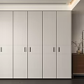 Modern Wardrobe With Sleek White Doors And Metal Handles In Minimalist Interior