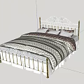 White and Gold Metal Frame Double Bed with Ornate Headboard Striped Quilt and Pillows