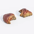 Two Freshly Baked Bitten Croissants With Golden Crust And Flaky Layers