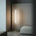 Modern Floor Lamp With Transparent Cylinder Shade Illuminating Minimalist Living Space