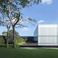 Contemporary Modern Building With Skylight Roof Glass Facade And Greenery